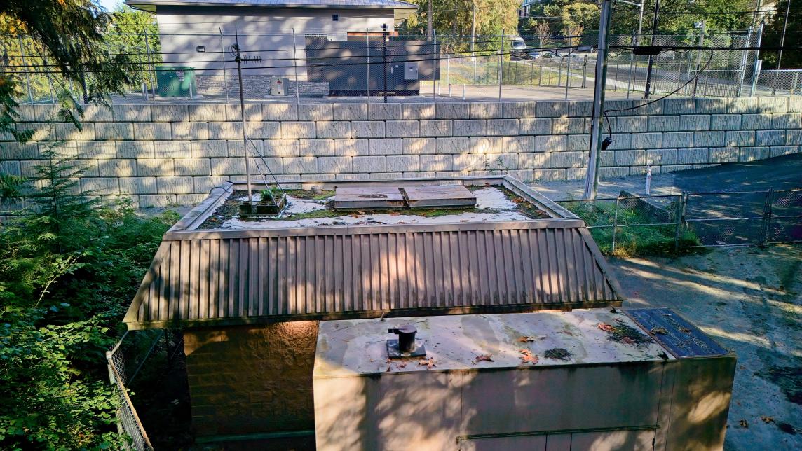 Side view showing new and old 236 Street pump station buildings