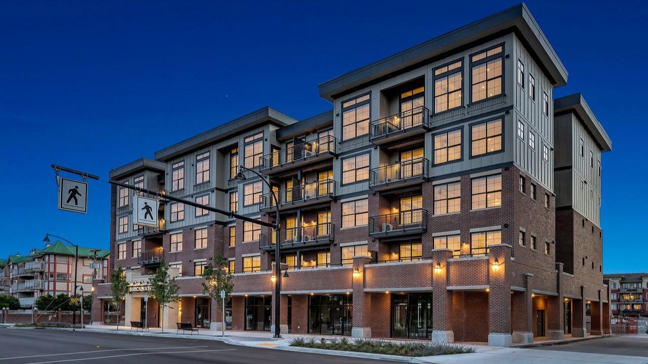 A mixed use apartment building with first floor shopping and upper residences.