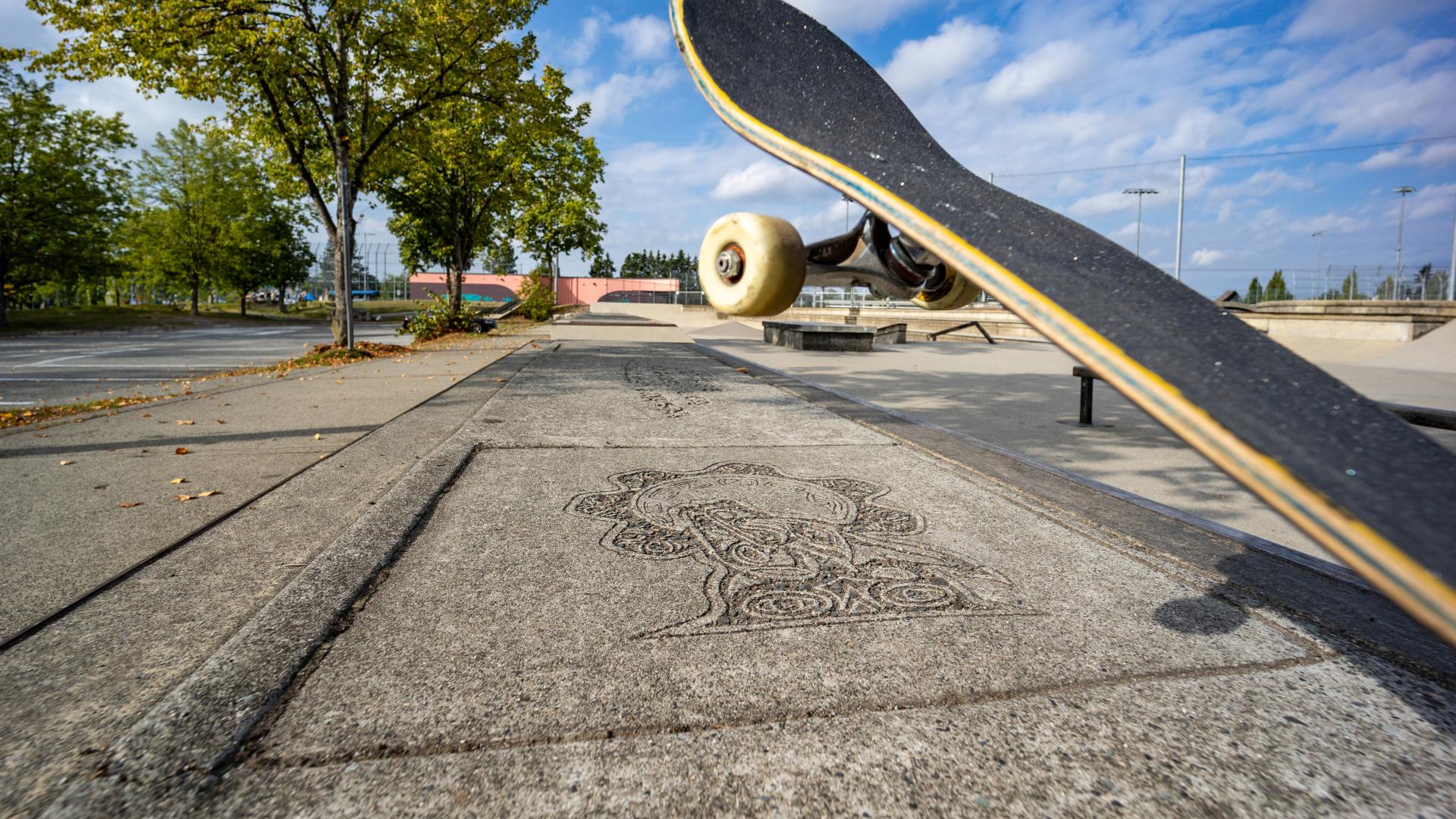 Skateboard with Public Art in the Sidewalk