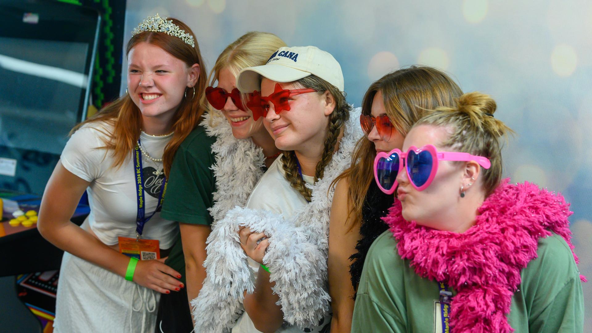 Group of Teens Posing for Fun Photo with Props Together