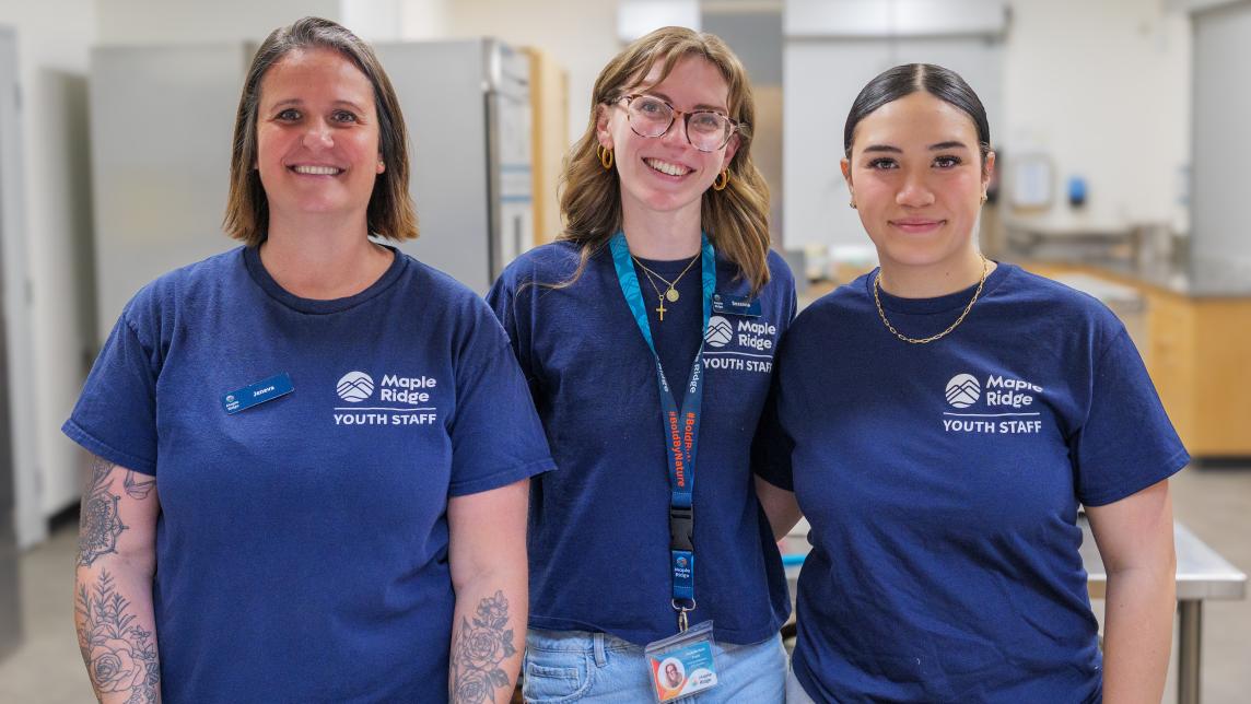 Three Youth Staff Standing Together