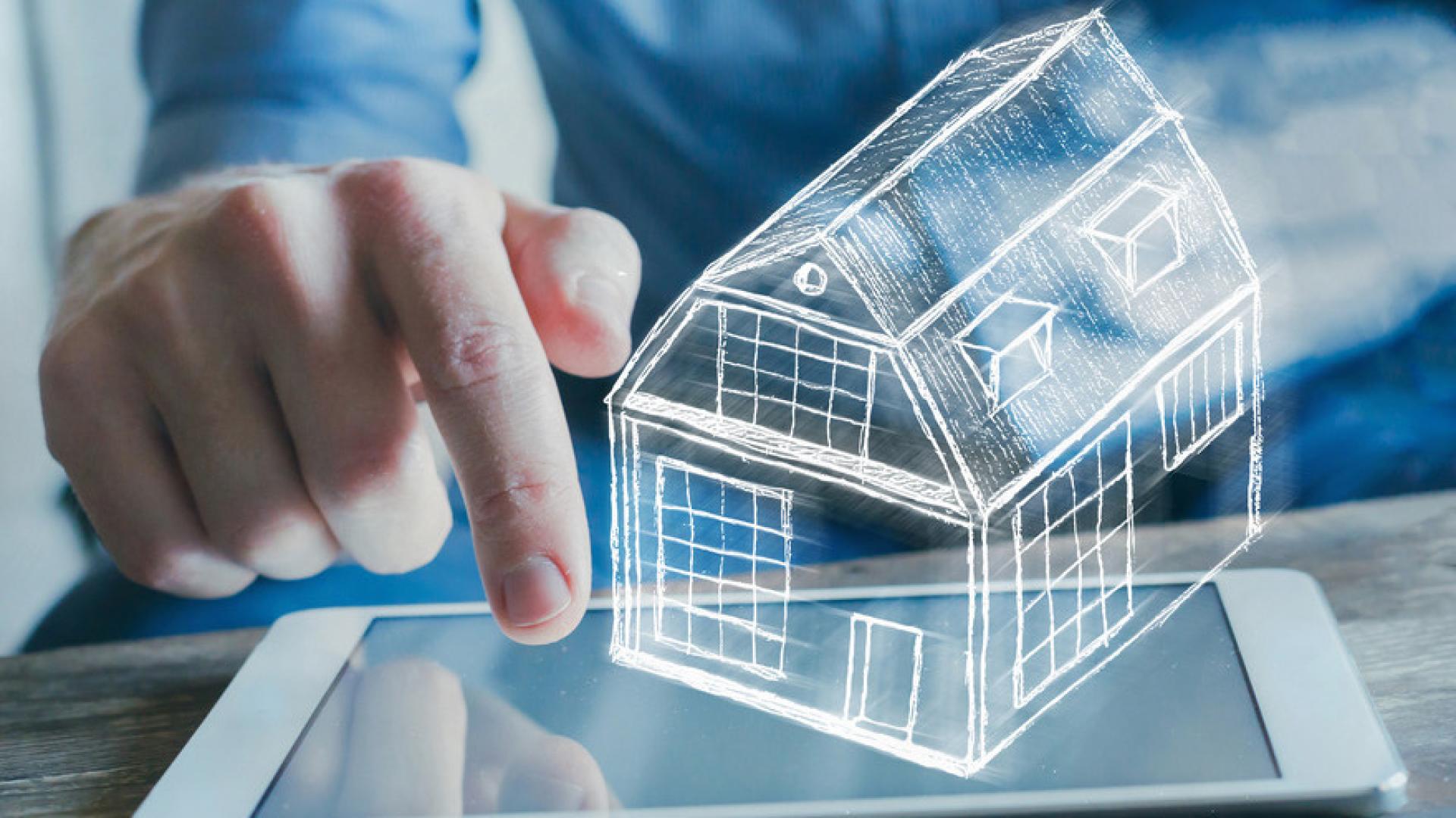 A man touches a tablet, with a white outline of a house appearing to float above the screen.