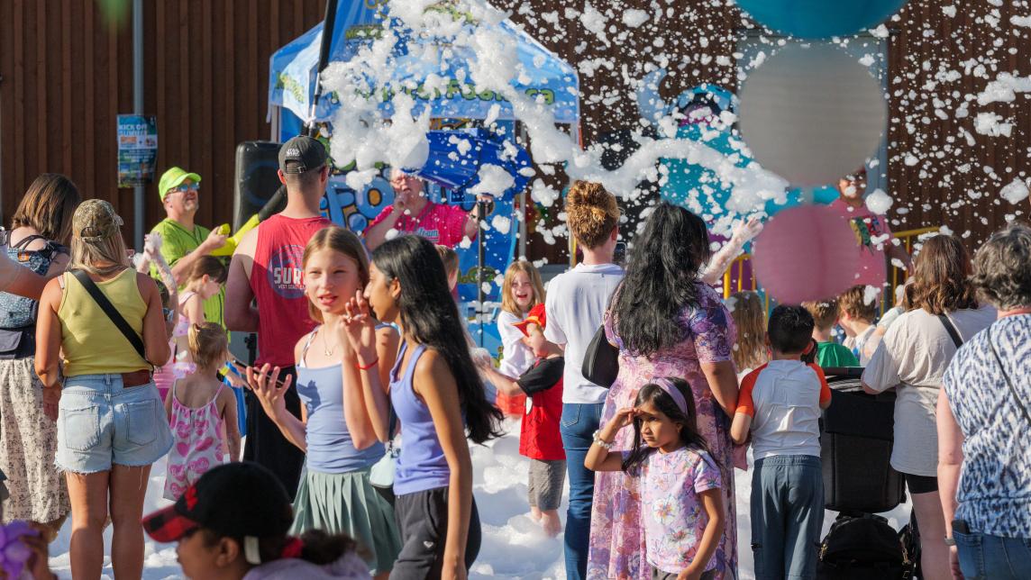 Crowd of People Outside Playing with Foam at Rock the Block at Albion Community Centre