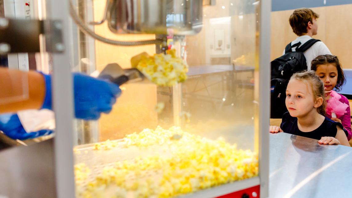Little Kids Watching Popcorn Being Made