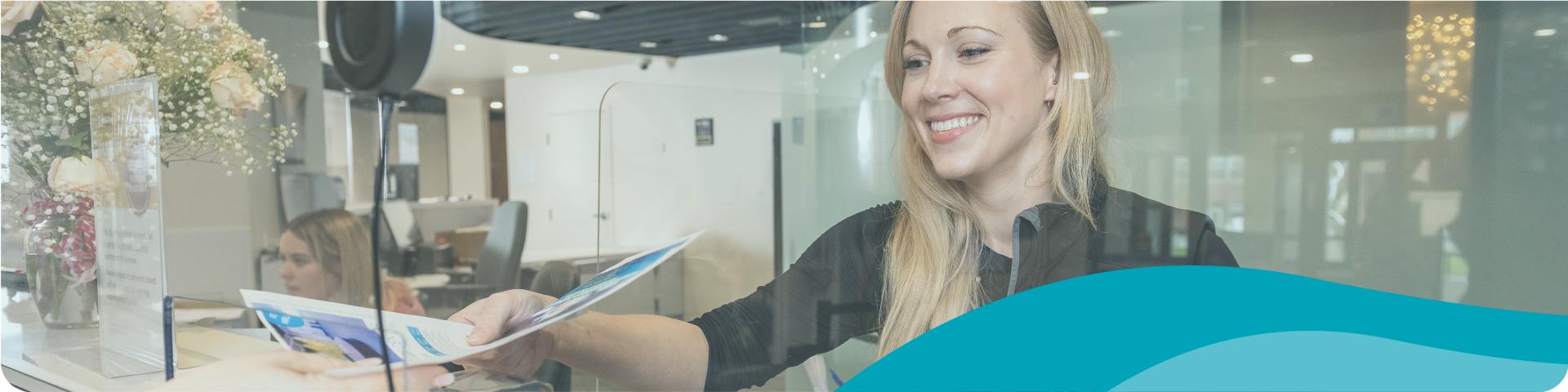 service desk woman helping with registration