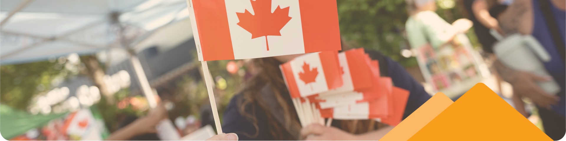 People Holding Canadian Flags Under City of Maple Ridge Tents at Canada Day