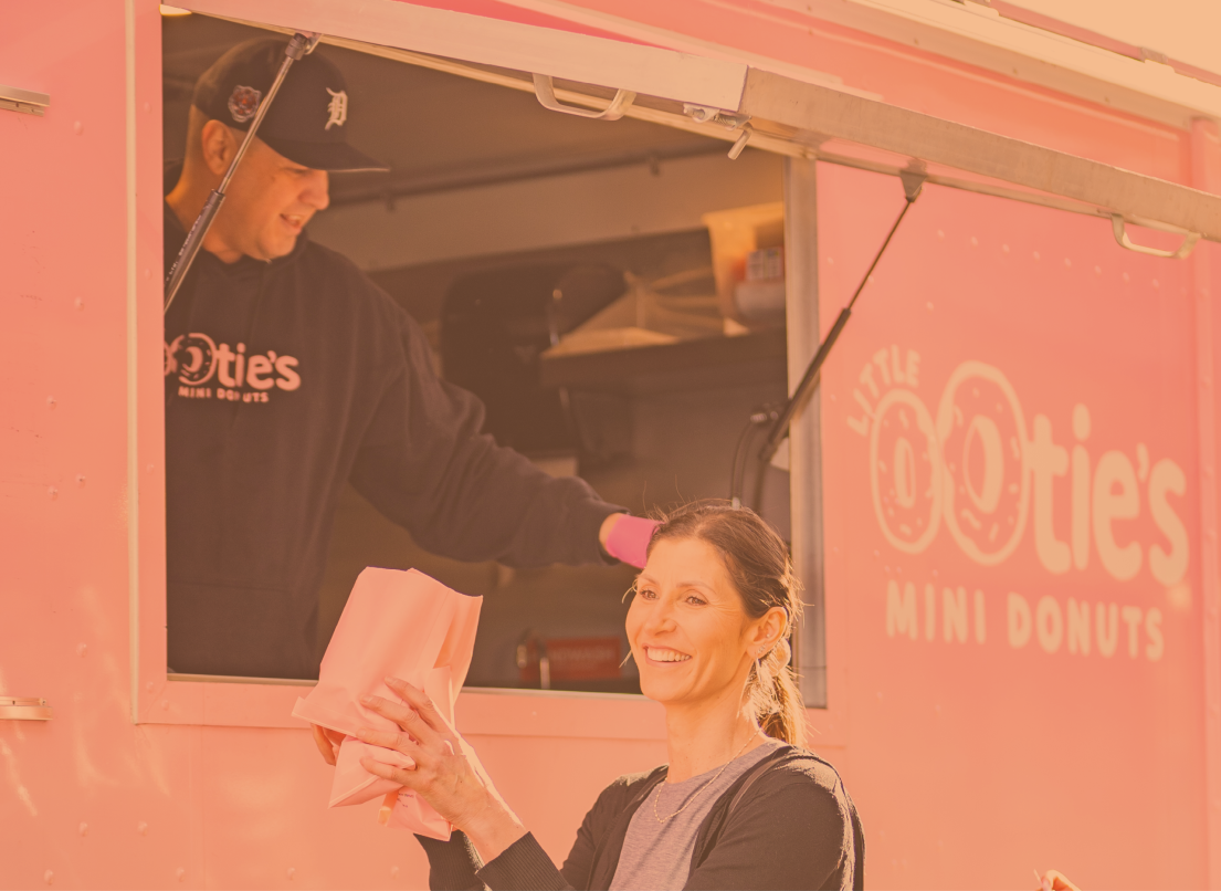 Person Collecting Food from a Food Truck