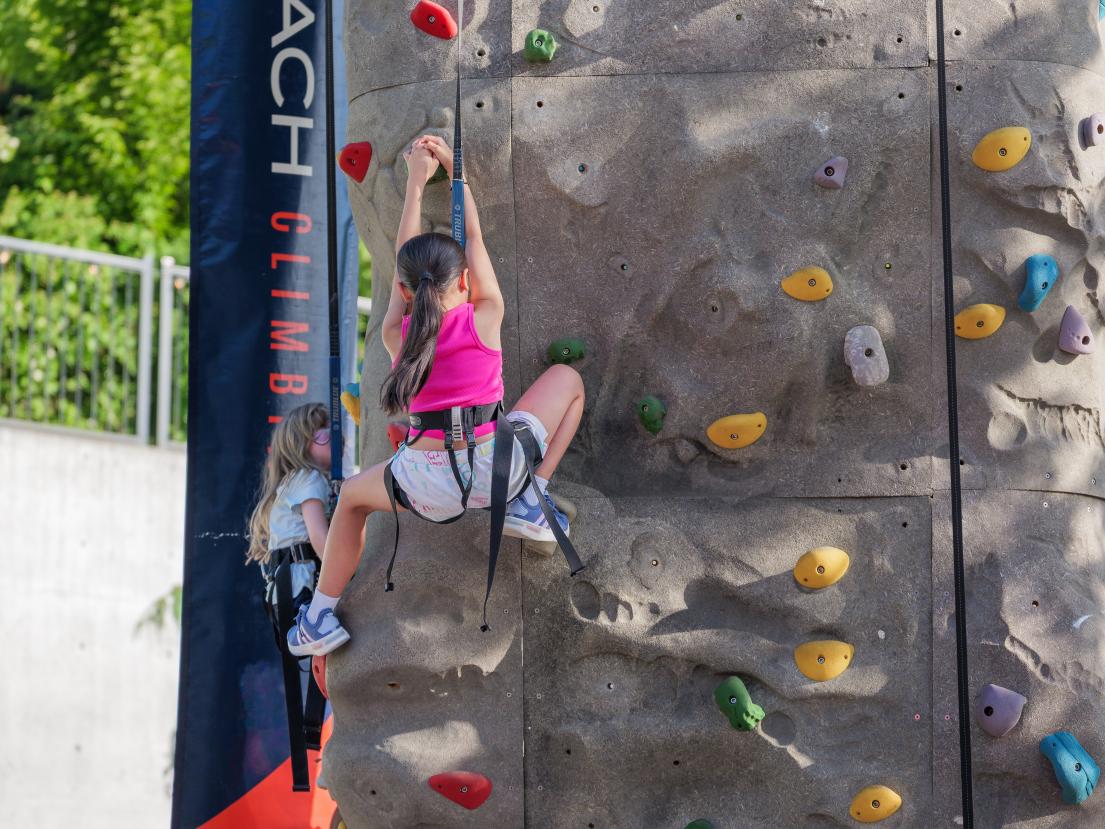 Young Girl Climbing the Rock Wall at Rock the Block at Albion Community Centre