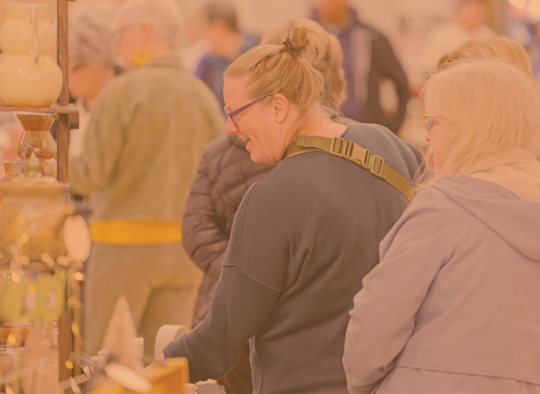 People Walking Through a Market at Albion Community Centre