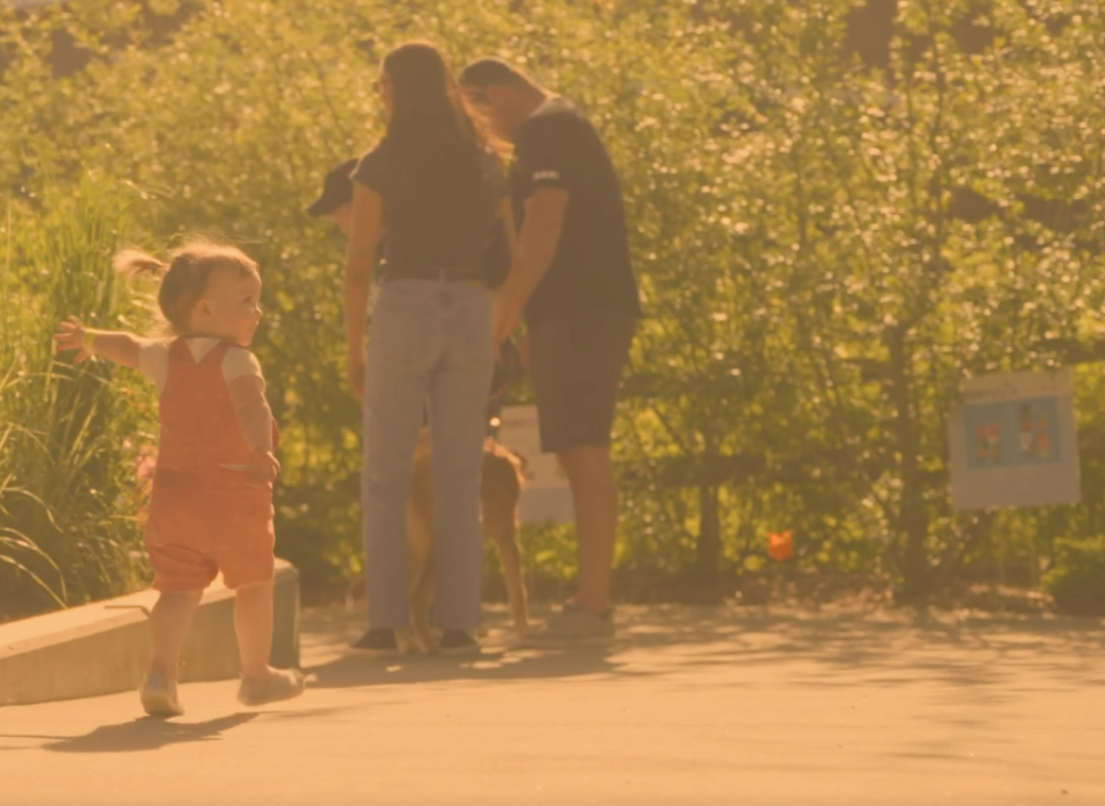 Family in the Backyard at Albion Community Centre Enjoying the StoryWalk