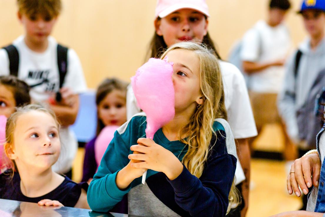 Youth Enjoying Cotton Candy at the Back to School Event