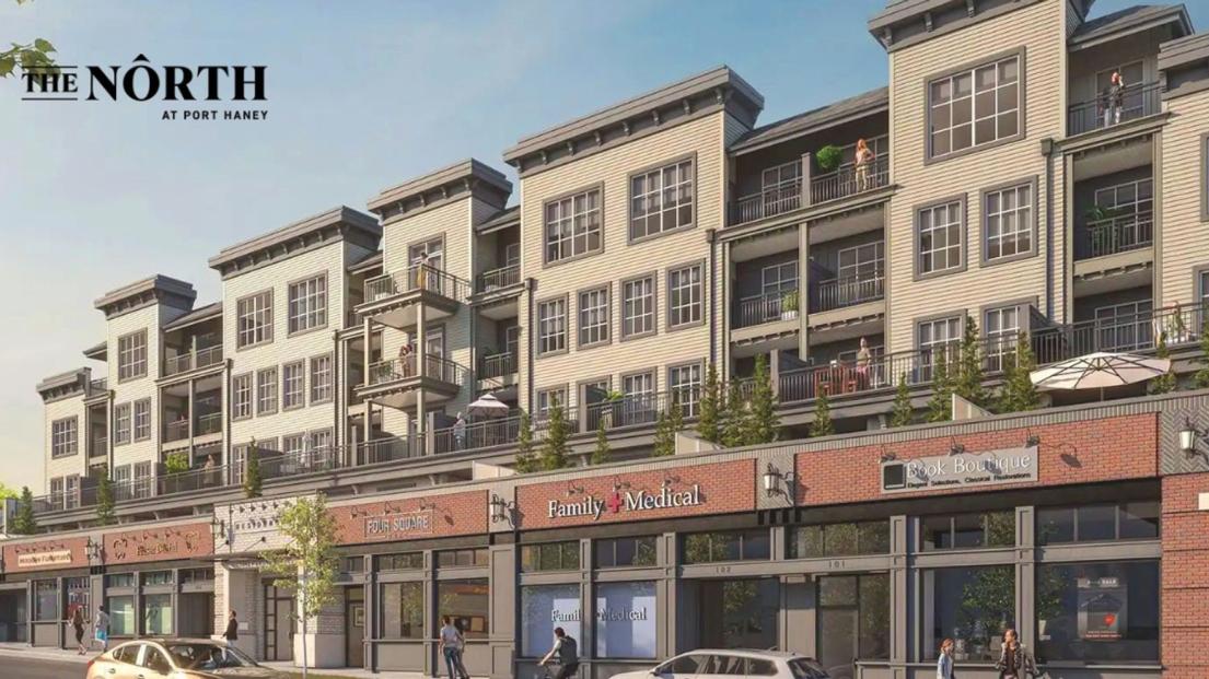 An artistic rendering of the North at Port Haney, showing an apartment building with shopping on the first floor framed in brick.