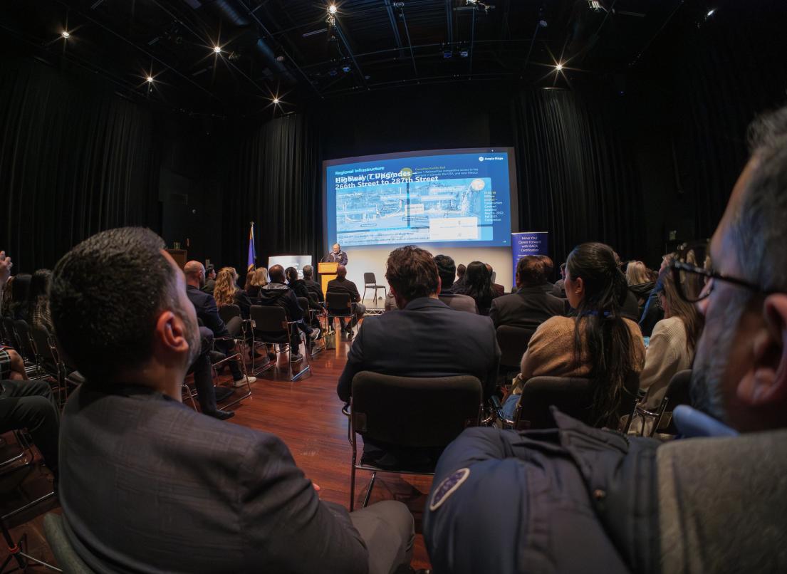 A large crowd watches Mayor Dan Ruimy speak at the 2026 Catalyst Innovation event.