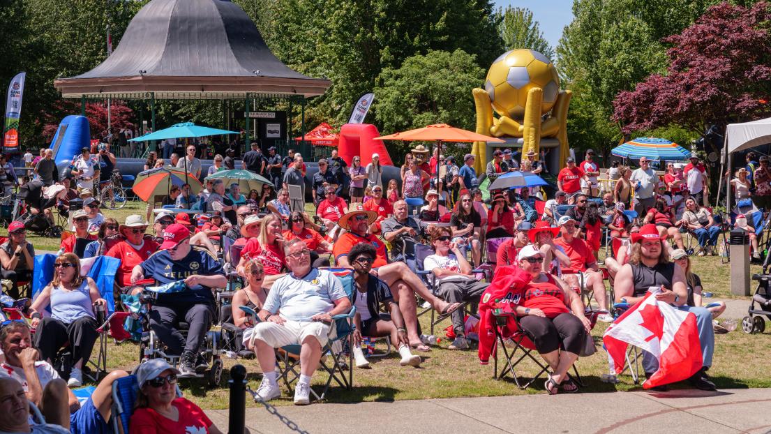 A large crowd decked out in Canadian memorabilia watch the World Cup in Memorial Peace Park.