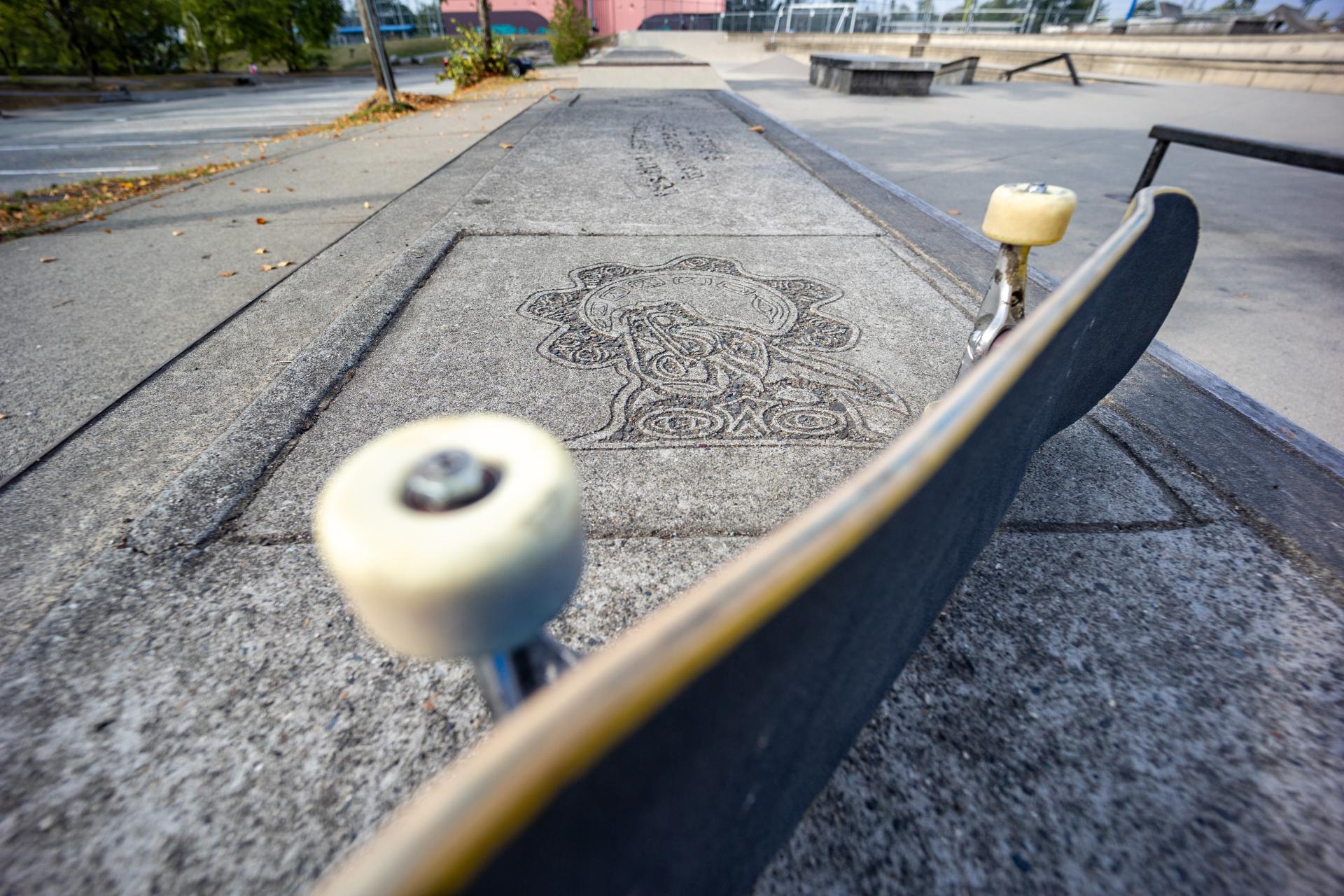 Skateboard with Public Art in the Sidewalk