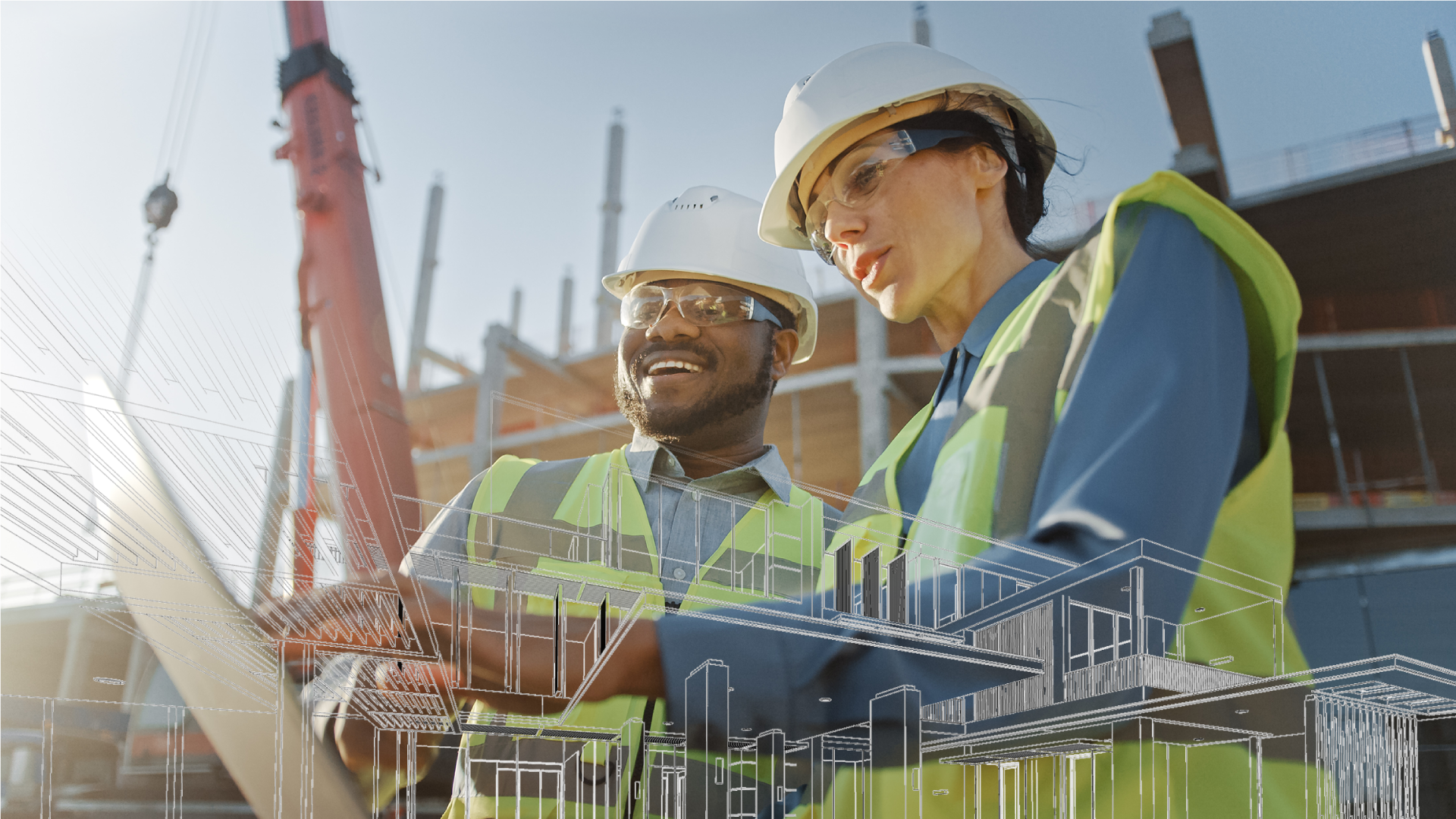 Two construction workers looking at blueprint plan