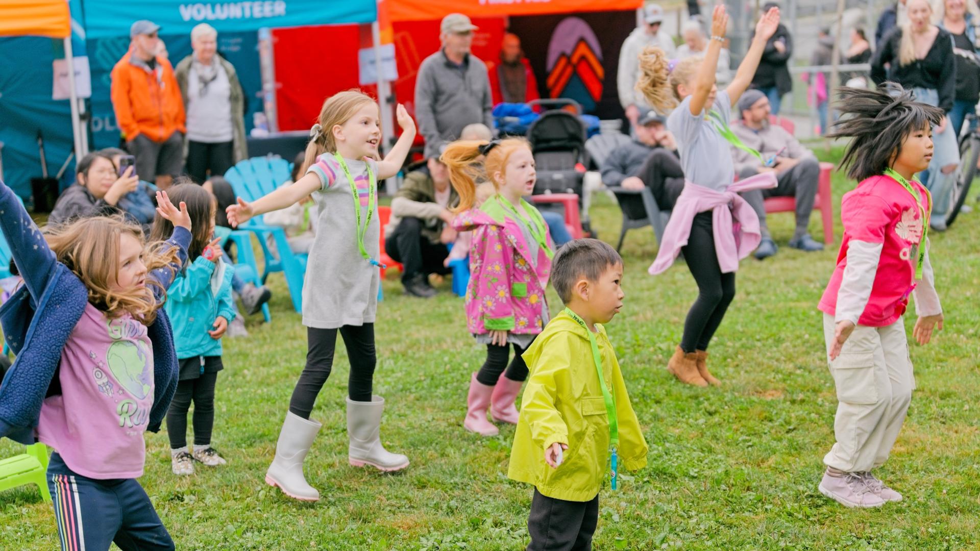 A crowd of kids hip-hop dance at a Rock the Block event.